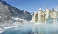 Outdoor heated swimming pool at the luxury 5-star Adler Spa Resort Dolomiti in Ortisei, Italy - Snow-wise - Best ski spa hotels in the Alps