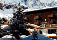 Exterior of the luxury 4-star boutique Hotel Bucaneve in Cervinia, Italy, close to the slopes, with its stunning mountain views, gourmet dining, fabulous spa facilities and swimming pool.