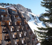 Exterior of the luxury 4-star Hotel des Dromonts in Avoriaz, France's snowiest ski resort, with its ski-in/ski-out location, gourmet dining and pure altitude spa with rooftop hot tub.