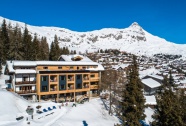 Exterior of the 3-star eco-friendly Hotel Waldhaus in Bettmeralp, Aletsch Arena, Switzerland, shown by Snow-Wise, with ski-in/ski-out access and mountain views.
