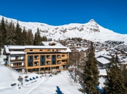 Exterior of the 3-star eco-friendly Hotel Waldhaus in Bettmeralp, Aletsch Arena, Switzerland, shown by Snow-Wise, with ski-in/ski-out access and mountain views.