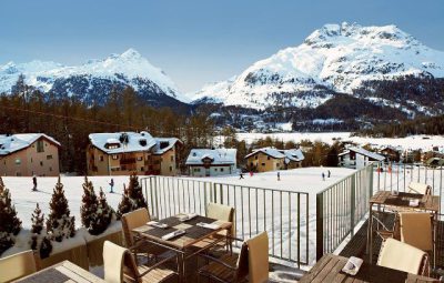 View from the outdoor terrace of the 4 star superior hotel Nira Alpina in St Moritz, Switzerland, overlooking the nursery slopes