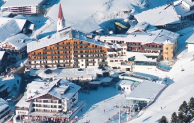 Overhead view of the exterior of the 4 star Hotel Edelweiss & Gurgl in the centre of the snowy ski resort of Obergurgl, Austria, in winter