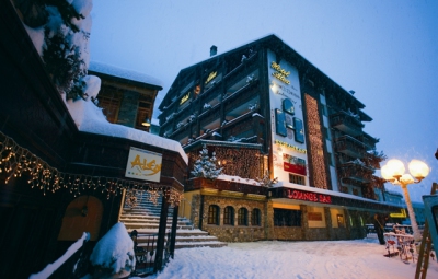 Night-time exterior view of the 4 star superior Hotel Alex in Zermatt, Switzerland, in winter with snow on the ground