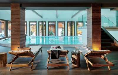 View of indoor pool area with loungers at the Hotel Montana Lodge & Spa ****, La Thuile, Italy