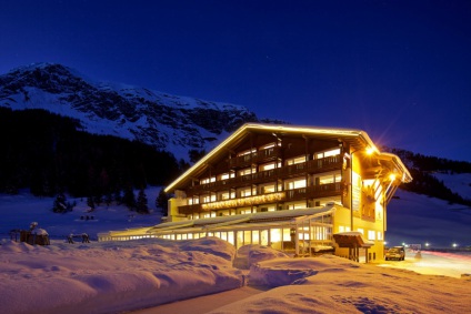 Exterior of the luxury 4-star Hotel Hintertuxerhof in Hintertux, Austria, at night - Snow-wise - Best ski hotels for families