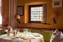 Traditional dining room in the 4-star Hotel Chesa Grischuna in Klosters, Switzerland - Snow-wise - Best ski hotels for alpine charm