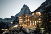 Exterior of the luxury 5-star hotel The Omnia in Zermatt, Switzerland with its Matterhorn views, contemporary mountain lodge style, gourmet dining and state-of-the-art spa