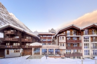 Exterior of the 4-star Schlosshotel Zermatt in Zermatt, Switzerland with its spa and swimming pool, Matterhorn views and location close to ski lifts
