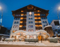 Exterior of the luxury 4-star superior Sertorelli Sport Hotel, with its mountain views, central location close to ski slopes, gourmet dining and impressive spa.