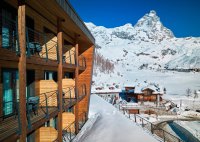 Exterior of the luxury 5-star Saint Hubertus Resort & Spa in Cervinia, Italy, with its exquisite luxury apartments, fabulous spa and swimming pool, stunning Matterhorn views, and gourmet dining.