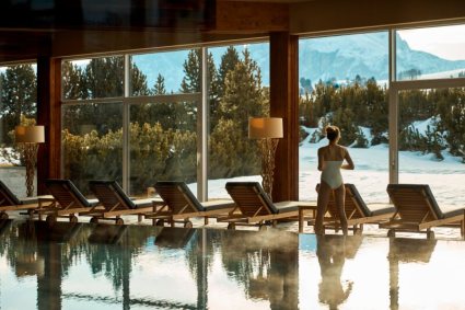 Swimming pool with Dolomite views in the luxury 5-star COMO Alpina Dolomites hotel in Alpe di Siusi, Italy, with stunning contemporary design, with panoramic mountain views, ski-in/ski-out access, gourmet dining and superb spa and wellness facilities