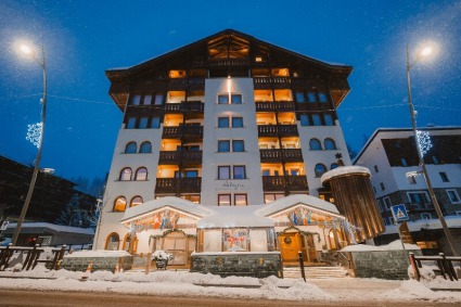 Exterior of the luxury 4-star superior Sertorelli Sport Hotel, with its mountain views, central location close to ski slopes, gourmet dining and impressive spa.