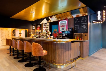 Retro-themed bar of the quirky, modern luxury 4-star RockyPop hotel in Flaine, France, with its central location close to the slopes, fabulous spa and leisure facilities, and range of dining options.