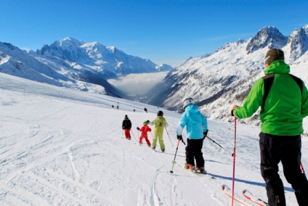 Family skiing on the slopes above the Chamonix valley - Snow-Wise - Tailor-made luxury family ski holidays at Easter 2027