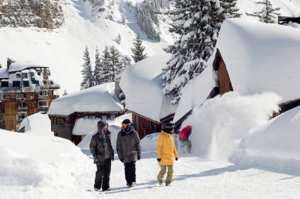 Deep snow covering chalet-style building roofs and streets in Avoriaz, French Alps, during winter 2015-16