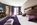 Bedroom in the modern 3-star Hotel Pointe Isabelle in Chamonix, France, with its central location, trendy bar and apres-ski terrace