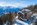 Exterior view and panoramic mountain views of the 3-star Hotel Waldhaus, eco-friendly ski hotel in Bettmeralp, Aletsch Arena, Switzerland, with ski-in/ski-out access