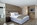 Bedroom in the luxury 5-star boutique CERVO Mountain Resort hotel in Zermatt, Switzerland with its Matterhorn views, contemporary chalet-style, ski-in/ski-out access,  gourmet dining and state-of-the-art spa