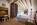 Bedroom in the luxury 5-star boutique CERVO Mountain Resort hotel in Zermatt, Switzerland with its Matterhorn views, contemporary chalet-style, ski-in/ski-out access,  gourmet dining and state-of-the-art spa