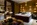 Bedroom in the luxury 5-star superior The Chedi Andermatt hotel The Omnia in Andermatt, Switzerland with its spectacular views, contemporary architectural design, gourmet dining and state-of-the-art spa