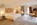 Bedroom in an apartment in the luxury 5-star Saint Hubertus Resort & Spa in Cervinia, Italy, with its exquisite luxury apartments, fabulous spa and swimming pool, stunning Matterhorn views, and gourmet dining.