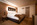 Comfort bedroom in the luxury 4-star superior Sertorelli Sport Hotel, with its mountain views, central location close to ski slopes, gourmet dining and impressive spa.