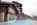Outdoor swimming pool in the slopeside, ski-in/ski-out luxury 5-star Les Terrasses d’Eos self-catering apartments offering panoramic mountain views, and spa facilities including heated outdoor pool.