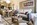 Lounge of an apartment in the slopeside, ski-in/ski-out luxury 5-star Les Terrasses d’Eos self-catering apartments offering panoramic mountain views, and spa facilities including heated outdoor pool.