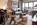 Lounge area of an apartment in the slopeside, ski-in/ski-out luxury 5-star Les Terrasses d’Eos self-catering apartments offering panoramic mountain views, and spa facilities including heated outdoor pool.