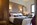 Bedroom in the slopeside, ski-in/ski-out luxury 5-star Les Terrasses d’Eos self-catering apartments offering panoramic mountain views, and spa facilities including heated outdoor pool.