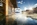 Outdoor heated pool of the luxury 5-star ski lodge Adler Lodge in Alpe di Siusi (Seiser Alm), Italy, with panoramic Dolomite views, spa facilities, and ski-in/ski-out access
